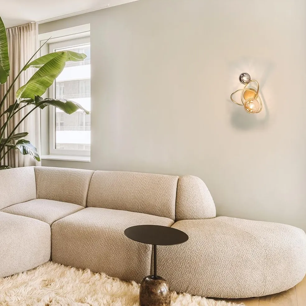 Gouden wandlamp met smoke en amber glas